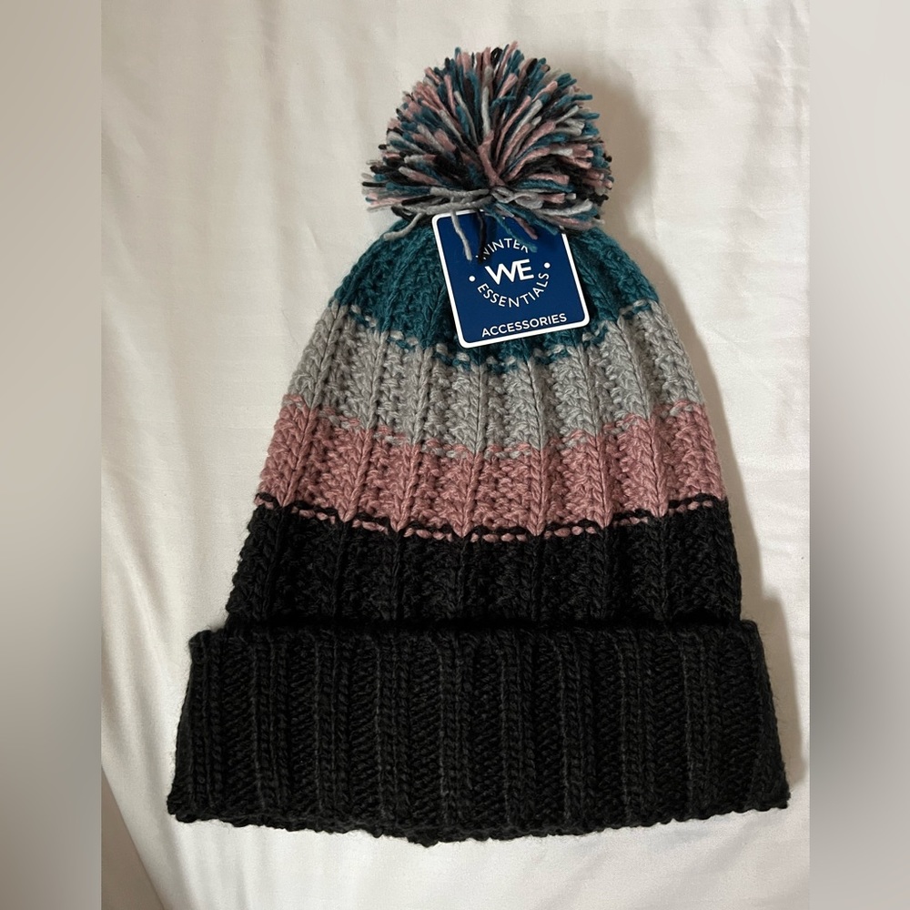 NWT Women’s Winter Essentials multicolor beanie with ball on top. One size